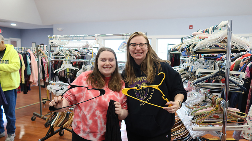 Students posing for a photo during a project Students posing for a photo during a project