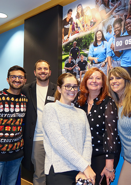 Attendees of the December unveiling posing for photos  Attendees of the December unveiling posing for photos