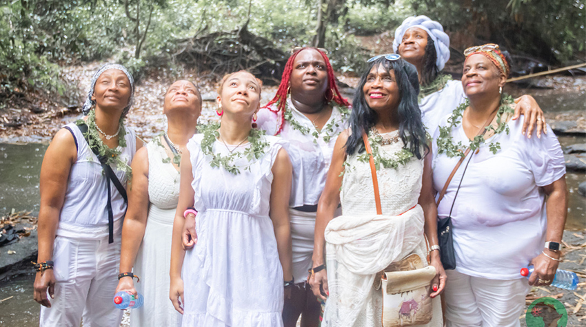 The group visited the Ancestral River Park and poured libations in an emotional ceremony that culminated in rain during the region's dry season.  The group visited the Ancestral River Park and poured libations in an emotional ceremony that culminated in rain during the region's dry season.