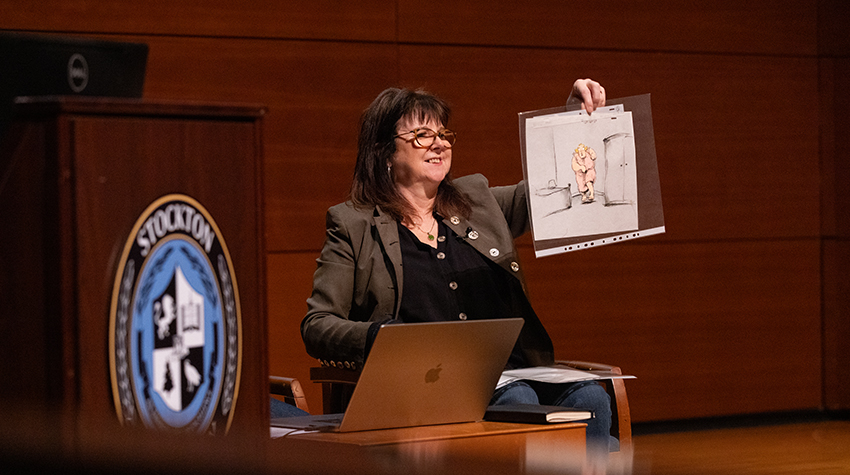 Joanna Quinn holding up one of her illustrations Joanna Quinn holding up one of her illustrations