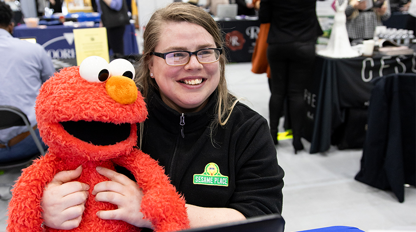 Julie Robinson of Sesame Place posed with Elmo for a quick photo Julie Robinson of Sesame Place posed with Elmo for a quick photo