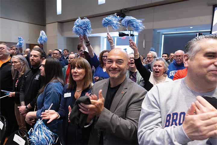 Stockton-colored pompoms along with orange and blue of Brookdale Community College were some of the colors in the crowd Stockton-colored pompoms along with orange and blue of Brookdale Community College were some of the colors in the crowd