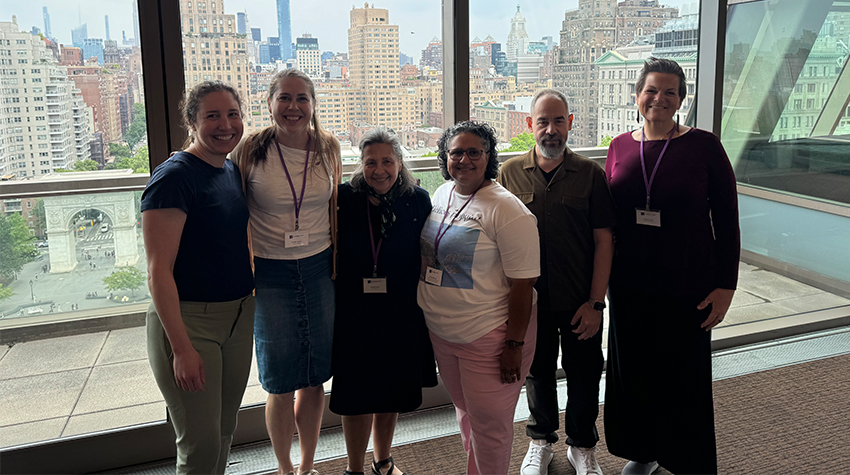 Group of faculty posing for a photo together. 
Courtesy of Elizabeth Lacey. Group of faculty posing for a photo together. 
Courtesy of Elizabeth Lacey.