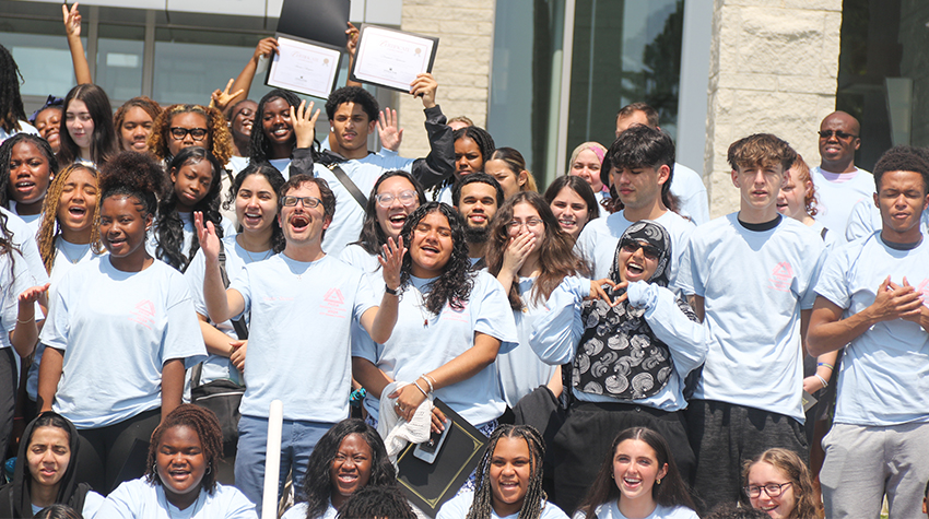 A large group of students cheering A large group of students cheering