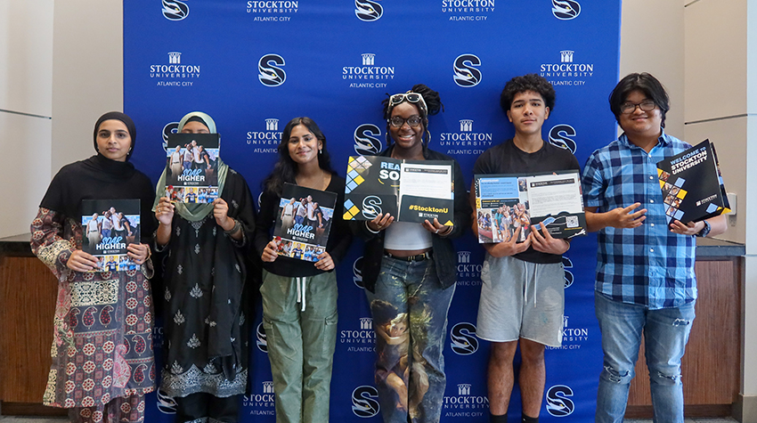Students posing for a photo during Instant Decision Day Students posing for a photo during Instant Decision Day