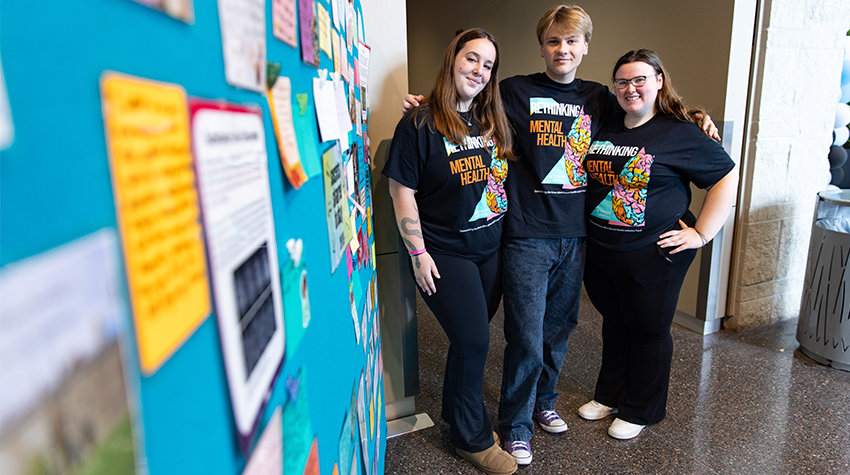 Students posed for a photo along the secrets wall. Students posed for a photo along the secrets wall.