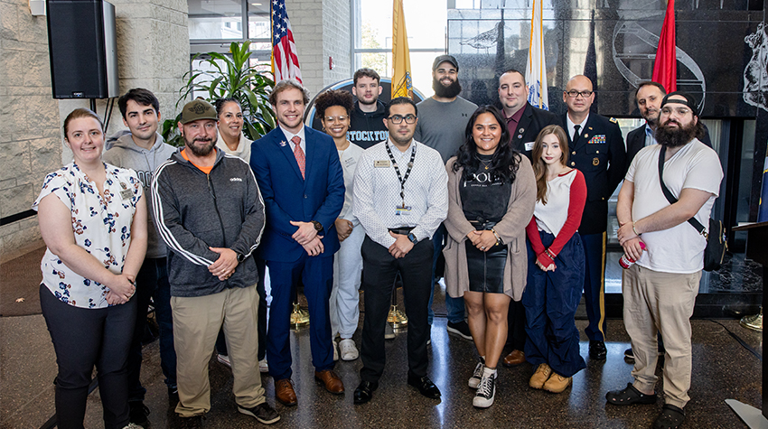 Barany, Jones, Mares, Smalling and student veterans posing for a photo. Barany, Jones, Mares, Smalling and student veterans posing for a photo.