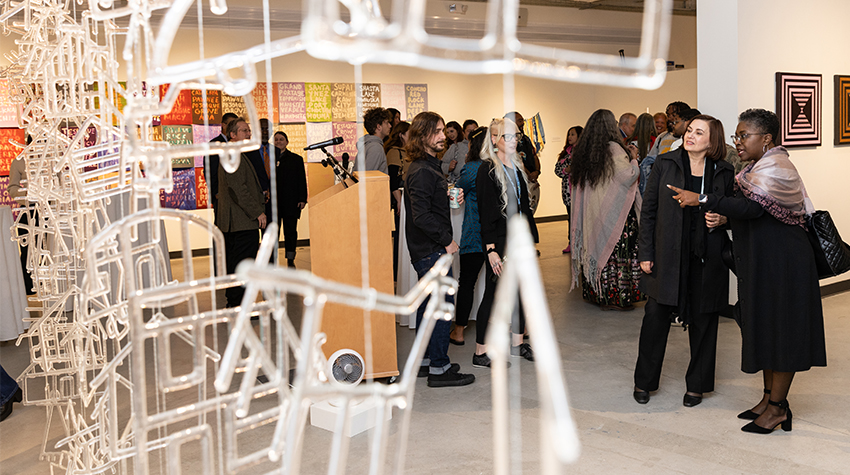 EVP Terricita Sass and BOT Chair Nelida Valentin viewing Joe Fedderson's glass chime display EVP Terricita Sass and BOT Chair Nelida Valentin viewing Joe Fedderson's glass chime display