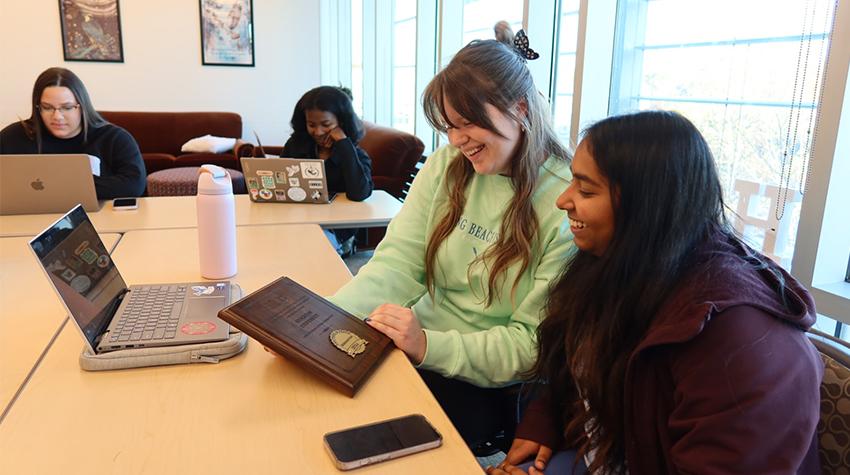 Students in the Honor College looking at the Nobel Designation Students in the Honor College looking at the Nobel Designation