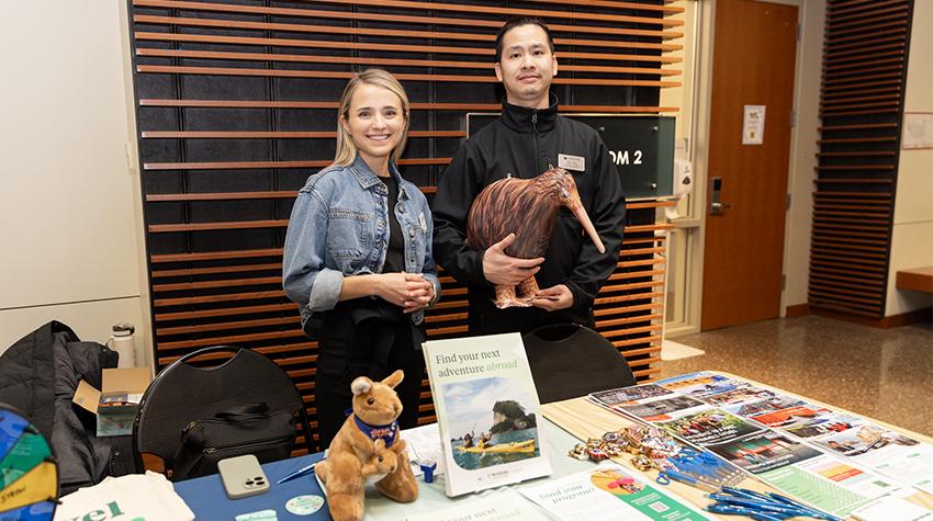 Yibin Feng with a student at one of the tables Yibin Feng with a student at one of the tables
