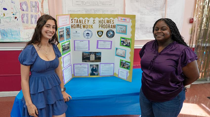 Two of Scott's students in front of one of the displays Two of Scott's students in front of one of the displays