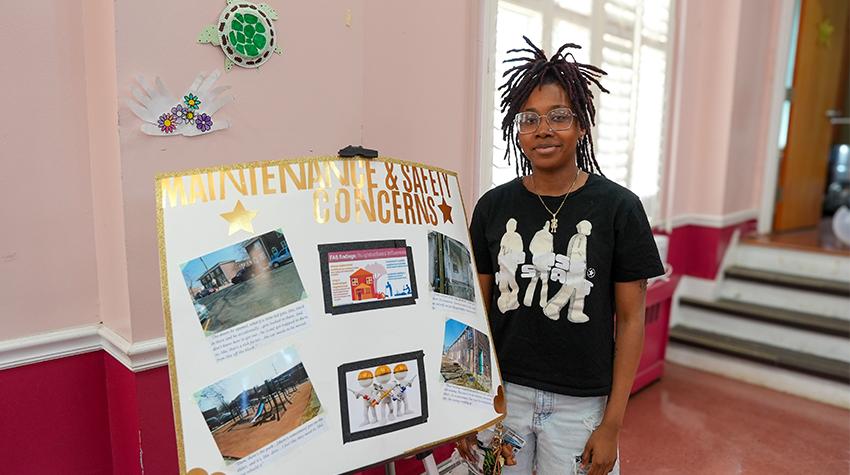 One of Scott's students in front of one of the displays One of Scott's students in front of one of the displays