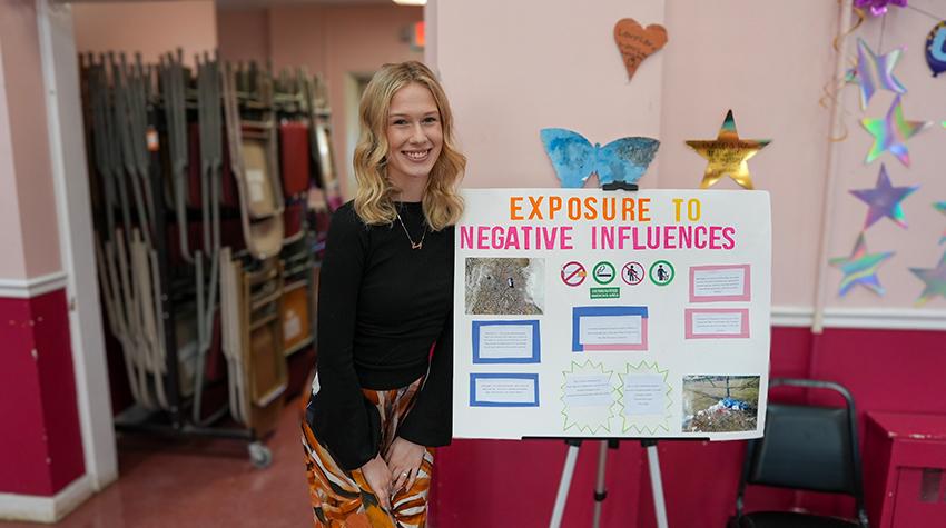 One of Scott's students in front of one of the displays One of Scott's students in front of one of the displays
