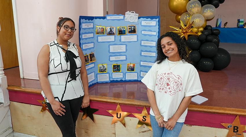 Two of Scott's students in front of one of the displays Two of Scott's students in front of one of the displays