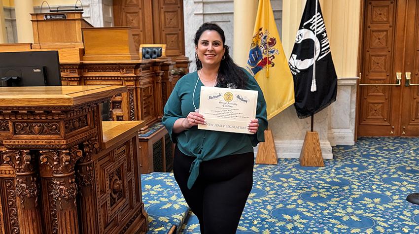 Alyssa holding a certificate she received at the NJ Statehouse. Alyssa holding a certificate she received at the NJ Statehouse.