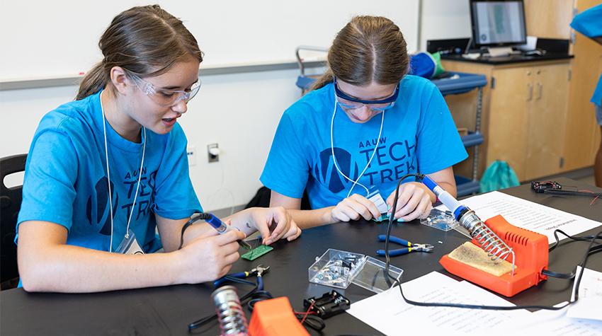 Tech Trek participants soldering circuit boards Tech Trek participants soldering circuit boards