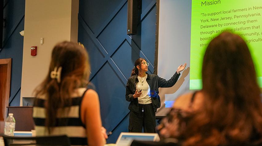 A student presenting on their product A student presenting on their product