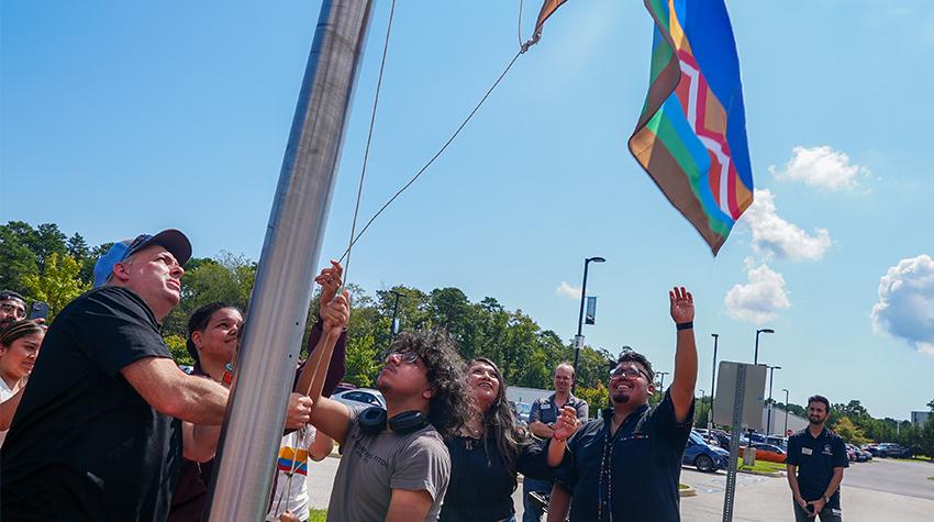 The flag being raised during the ceremony The flag being raised during the ceremony