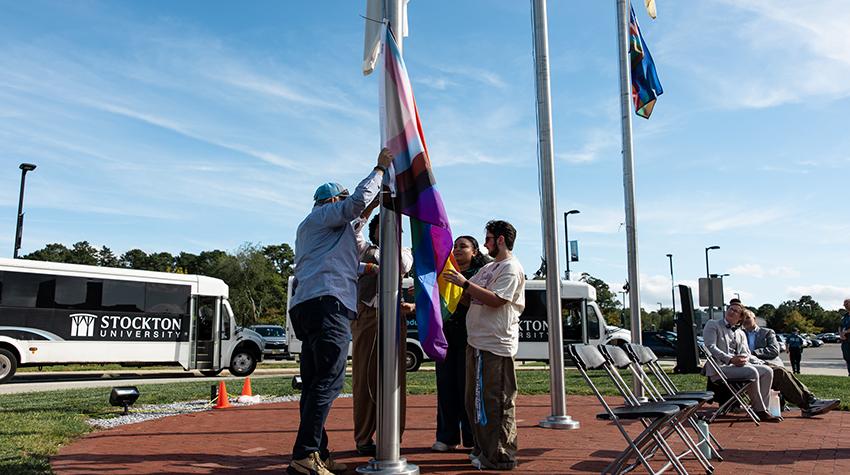 The rainbow flag being raised The rainbow flag being raised