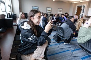 Students in a Communication Studies class capture content and collaborate in a modern computer lab.