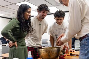 Buddhist and Hindu ritual objects featured in a classroom presentation on world religions at Stockton University.