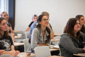 Students engage deeply in classroom discussion about ethics, belief, and the human search for meaning.
