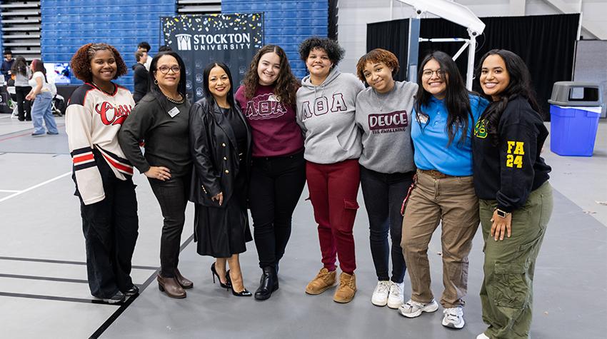 Greek Life students posing for a photo with Heather Medina Greek Life students posing for a photo with Heather Medina