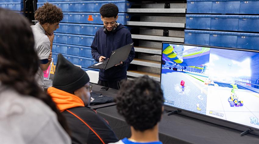 Students checking out the Esports table Students checking out the Esports table