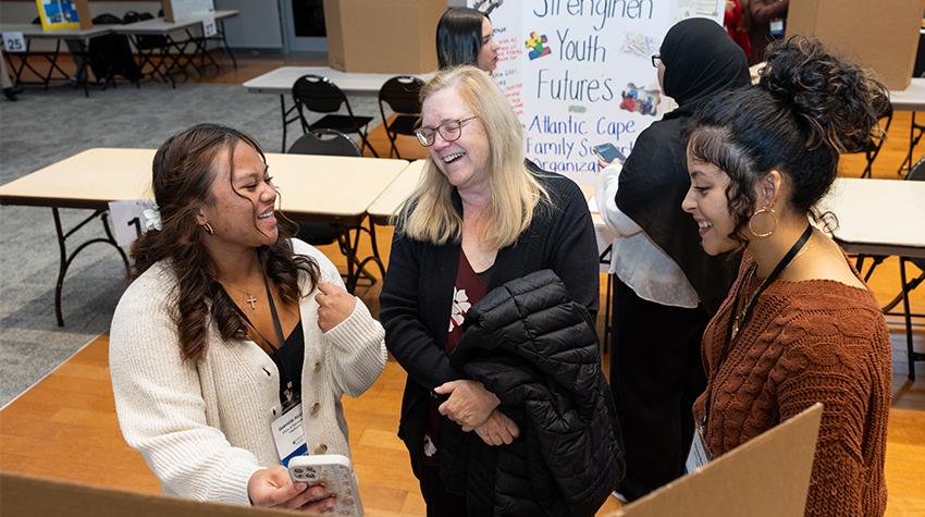 Students talking amongst themselves during Celebration of Service Students talking amongst themselves during Celebration of Service