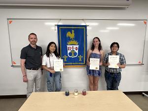 Students are honored during the induction ceremony for the language honor society.