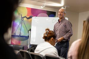 A faculty member leads an engaging discussion on language, culture, and global perspectives.