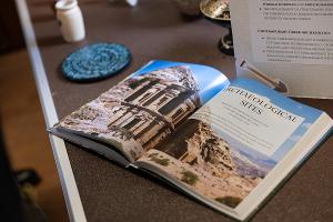 An open text highlights archaeological sites and cultural history explored in language and culture studies.