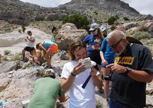 Students work side by side with expert faculty as they analyze rock samples and practice professional field techniques.