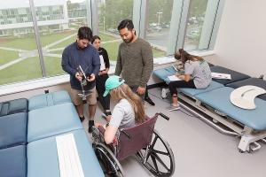 Students learn patient handling and mobility techniques in bright, modern PT labs designed for real clinical practice.