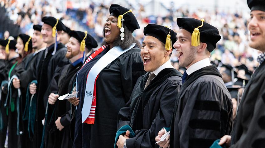 Graduates singing the Stockton Song Graduates singing the Stockton Song