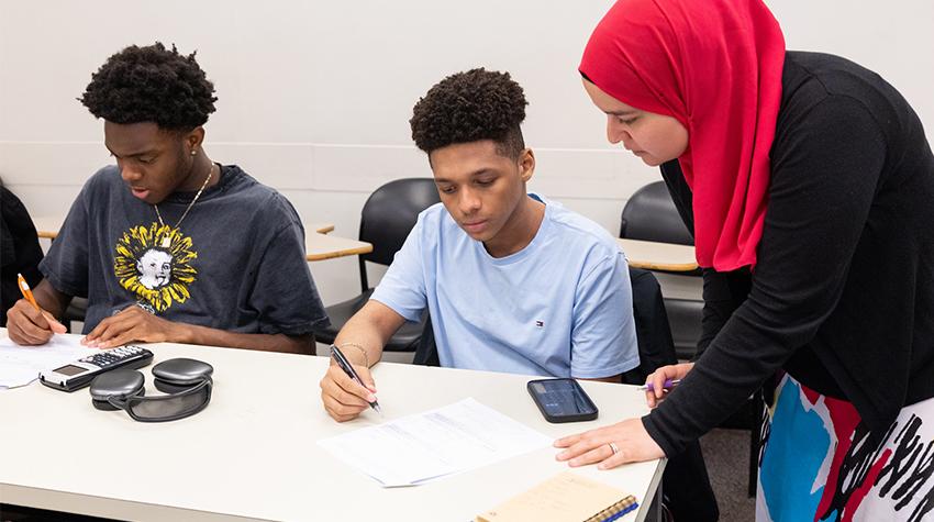 Students receiving help during EOF's Summer Academy Students receiving help during EOF's Summer Academy