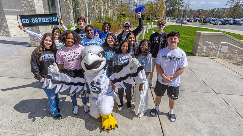 Students posing for a photo with Talon Students posing for a photo with Talon