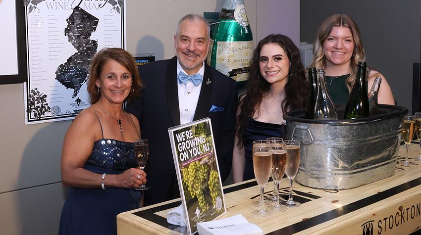 President Joe Bertolino, a faculty member and students posing for a photo during the Scholarship Benefit Gala President Joe Bertolino, a faculty member and students posing for a photo during the Scholarship Benefit Gala