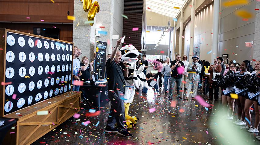 Talon and students celebrating Ospreys Give Talon and students celebrating Ospreys Give
