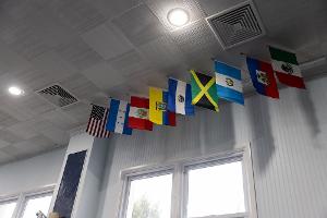 International flags displayed in a Stockton University classroom reflect the Historical Studies program’s global perspective on culture, history, and human experience.