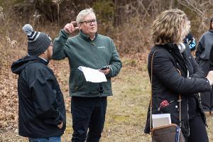 A History faculty member leads students in on-site discussion, connecting historical interpretation to real places and lived landscapes.