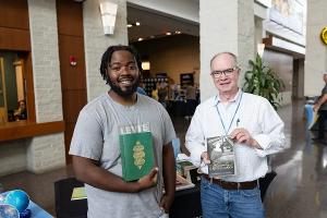 Literature faculty and students connect over shared texts during a campus event celebrating literary scholarship and reading culture.
