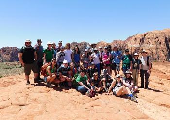 Geology students from Stockton University explore layered rock formations during a field study, examining Earth’s history through real-world observation.