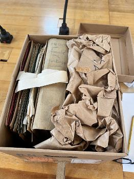Archive documents in a box found during Professor Olson’s research in France