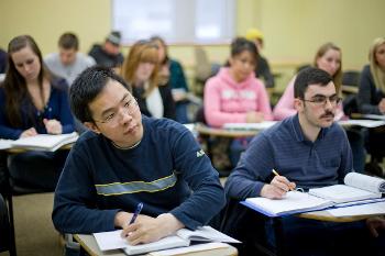 Accounting students participate in a classroom discussion focused on financial analysis, business reporting, and problem-solving skills at Stockton University.