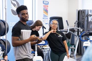 Stockton University Exercise Science students collaborate in active lab settings while building skills in fitness assessment, wellness programming, and human performance evaluation.