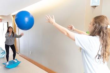 Stockton occupational therapy students explore balance, coordination and movement through an interactive activity using adaptive equipment, bringing classroom concepts into an active learning environment.