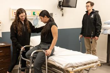 Stockton occupational therapy students develop practical skills in a realistic care environment, strengthening clinical reasoning, communication and safe mobility techniques as they prepare for professional practice.