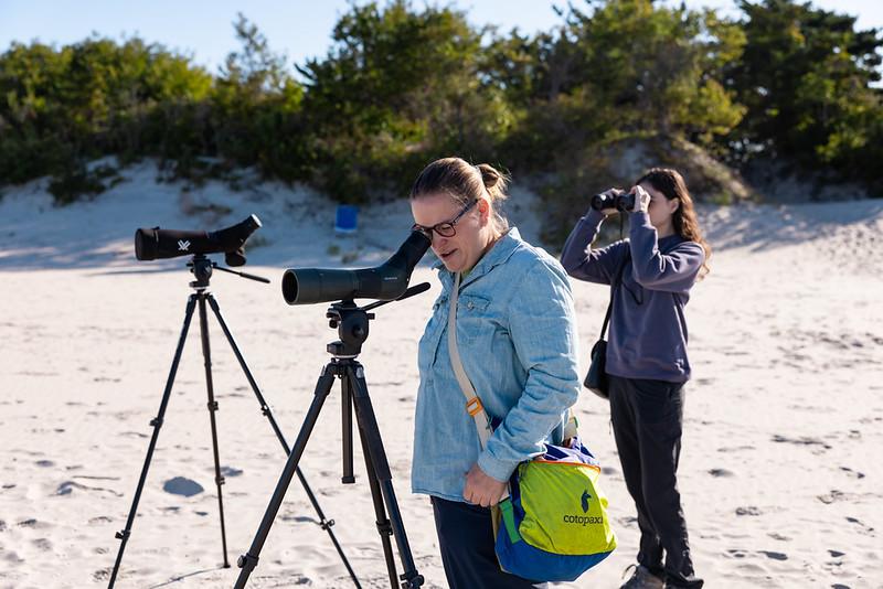 Emma Witt looking through a scope