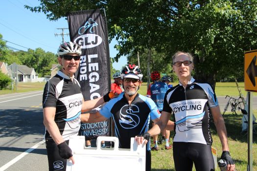 Riders taking a break at the 62 mile turn around sign.